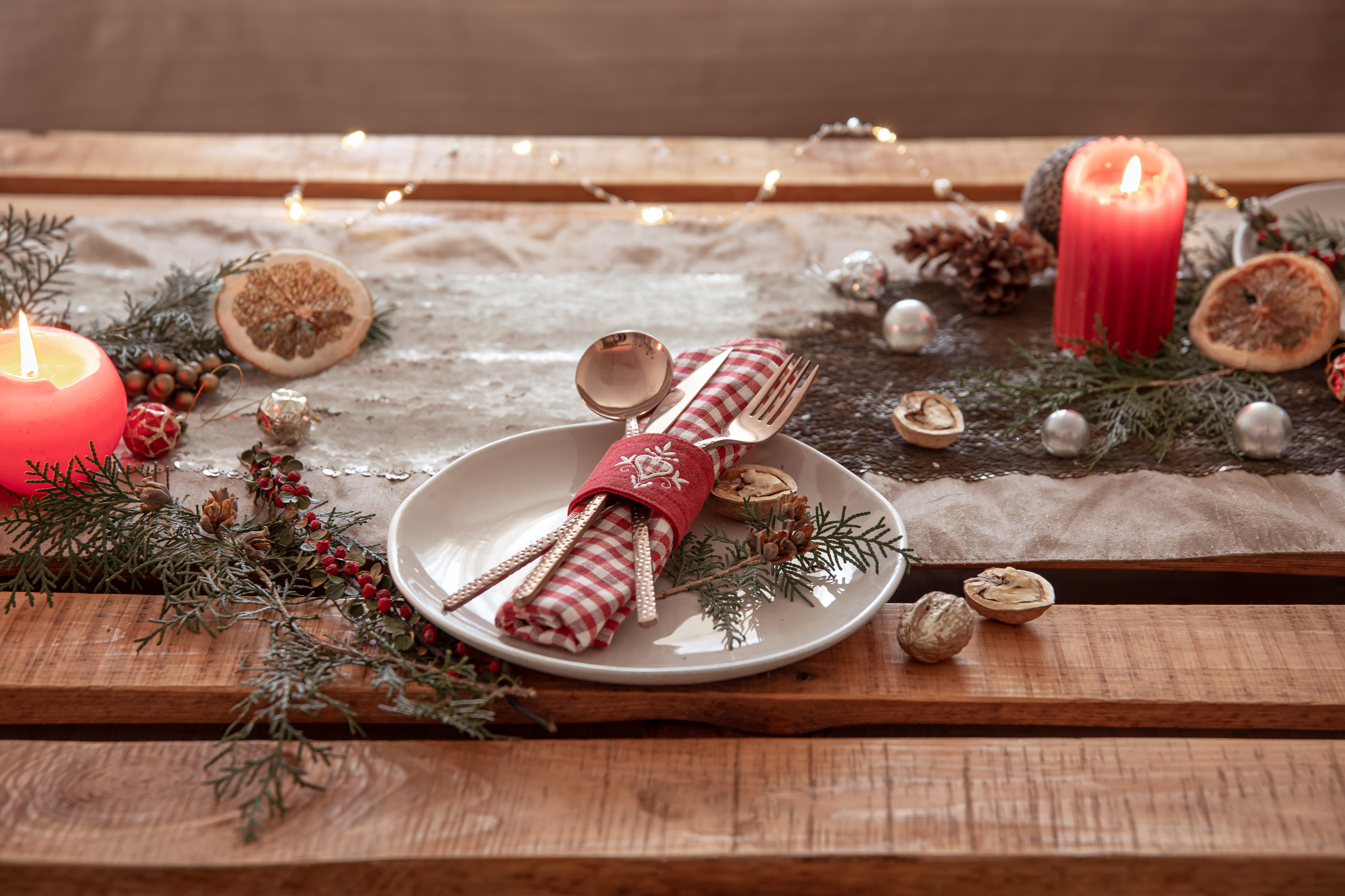 christmas background with cutlery and plate on the festive table copy space